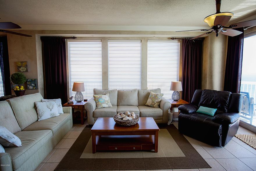 This amazing east end corner unit is everything you could imagine as far as views are concerned. There are incredible views of the Gulf, Shell Island, St. Andrews Bay, St. Andrews State Park, and Grand Lagoon.  The balcony of this unit wraps all the way around the east side of the building. It is decorated beautifully with furnishings and wall art/accessories. The window treatments are custom and quite lovely. The large ceiling to floor windows give this unit an abundance of light and accent the views even more!  This unit also conveys with a storage unit located on the same floor. The 3rd bedroom/bunk room is oversized with a double bunk bed. Schedule your private showing today!  This one won't last long. 

(All measurements approx.)