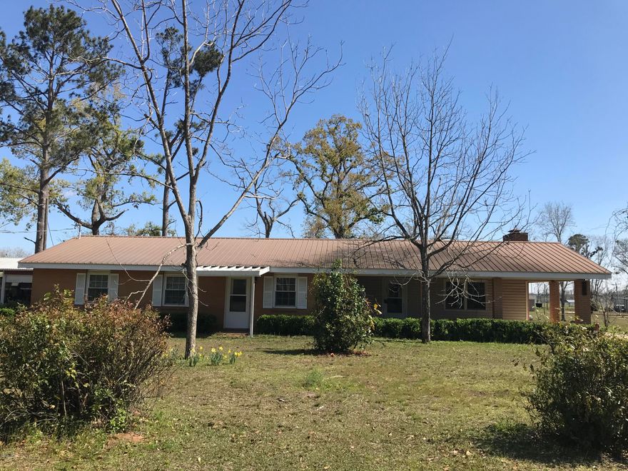 Currently Under Contract - Seller is taking back-up offers.  CALLING ALL WHO LOVE FISHING. Want to retire & live very close to Lake Seminole?  3 Bedroom 3/4 bath home located in an established neighborhood of Sneads, Fl.  Bathroom has been completely remodeled with a huge handicapped walk-in shower & Subway tiles on the wall. Kitchen has lots of cabinets & an island bar. Fireplace with wood burning stove.  Large pole barn to park an RV.  Spacious yard with storage buildings.   Located very close to the grocery store, school, Post Office, & the world renowned Bass fishing spot of Lake Seminole.
