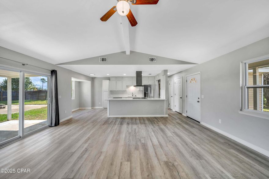 Wow - come see this updated home just a short 8 minute drive to Tyndall Air Force Base!  Perfect family home with 2 car garage and 3 bedrooms and 2 full baths with great open concept layout.  Nicely updated over the years with newer roof, siding and windows, and upgrades include newer flooring, granite countertops and stainless steel appliances in kitchen and more.  Enjoy a covered patio to relax and large yard for family fun. Move in ready! Call us today and make this your next home or investment property!