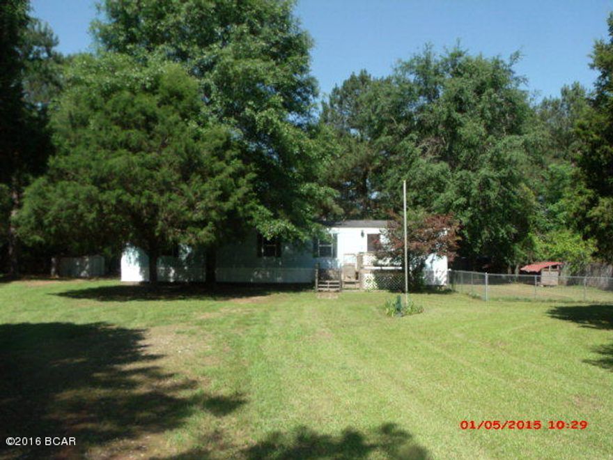 Very nice, move in ready, 2BR/2Ba mobile home located on just under an acre in Creekwood subdivision. Home features a split floor plan with new carpet and floor coverings. Beautiful shaded yard featuring covered BBQ area with electrical outlets, horseshoe pit, covered back porch with electrical outlets, and large dog pens. There is a 12 X 14 metal storage building. This home is close to all amenities of Marianna. Make an appointment to see this one!