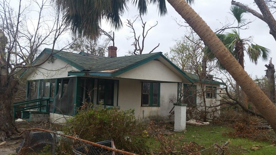 Great Investment on a Large Lot Close to Downtown, Shopping, Dining and St. Andrews Bay! This is great investment property or for a buyer looking to rebuild. 1st 3 photos have been updated after Hurricane Michael. The property took damage but still intact and only house on street standing. Damage: Roof and interior ceiling needs to be replaced, Chimney off, trees down and debris needs to be cleaned up , screen on porch needs to be replaced, carport piling off and water inside from roof and broken window. Seller says BRING ALL OFFERS!