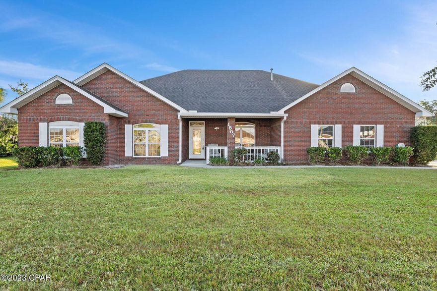 CURRENTLY UNDER CONTRACT, SELLER WILL CONSIDER BACKUP OFFERS
This single-story brick home, featuring 5 bedrooms and 3 bathrooms, is an exceptional find in the highly sought-after Lynn Haven area. Built in 1997 this residence seamlessly combines classic charm with modern comfort. The kitchen is a focal point, boasting top-of-the-line Kenmore Elite Stainless Steel Appliances, while stylish tile flooring graces the kitchen area and breakfast nook. On cooler evenings, the wood-burning fireplace provides a cozy atmosphere. The house is predominantly electric, with the exception of the natural gas hot water heater and a convenient gas grill hookup in the backyard. The peace of mind that comes with a generator-ready setup for unexpected power outages is a valuable feature. The well-designed floor plan includes a guest bedroom with its private bath and a luxurious master bedroom suite. Additionally, three more bedrooms share a full bath adorned with maple cabinets and marble countertops. The property offers not one, but two garages - a 2-car garage attached to the house and a separate brick garage with storage space and a workshop. Outside, the saltwater in-ground pool and the sprinkler system create an oasis. A generous 110' concrete drive accommodates RVs, ATVs, or boats. With meticulous maintenance and move-in readiness, this Lynn Haven residence promises a comfortable and well-appointed living experience. Don't miss the chance to schedule an appointment to explore this remarkable property and all its exceptional features, including a Florida sunroom. It's conveniently located just 1.5 miles from downtown Lynn Haven, making it easy to access the town's amenities, restaurants, and shops, and it's also close to the boater's paradise of West Bay. This home truly offers the best of Florida living.