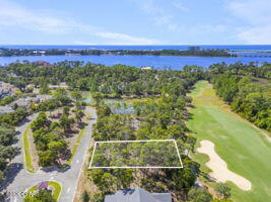 Now is your chance to own a lot located on Fairway 16 of the Sharks Tooth Golf Course and this lot also comes with an approved set of Engineered house plans by Coastal Architects and a landscape plan that have been approved by the ARB.  Build your dream home on this quiet street and located near the community pool, fitness center and the boardwalk overlooking Lake Powell.  This is is a high and dry premium lot in a premium location at a great price.  Wild Heron is one of the largest Dune Lakes in the South.  You will love the feel of this Coastal Craftsman Architecture homes throughout the neighborhood.  Residents enjoy access to top-tier amenities including a community dock, fitness center, resort-style pool, boat house and Shark's Tooth Golf Club membership may be purchased.   Call your agent to walk the lot and see the plan of the this 2527 q ft of living area, 477 sq ft of covered porches for relaxing and entertaining and an oversized garage of 583 sq ft.  Now is the time to build your custom home on this desirable lot.  Call your realtor today for more detailed information.