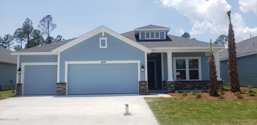 The Sand Dune Carolina elevation floor plan features 1946 sq ft and a 2-car garage. Optional upgrade for a 3rd car available. All interior features have 9 and 10 foot ceilings, tile and carpeted floors, granite countertops, a gas stove, microwave, dishwasher and garbage disposal. Upgrade options are available. The kitchen highlights a spacious kitchen island with beautiful granite countertops. All builds are above hurricane code with 2'x6' exterior wall framing, hurricane tie down rod and anchor system, architectural shingles and higher insulation ratings. Breakfast Point is just minutes from the beach and shopping. Please visit the model home located at 206 Basin Bayou Drive for more information! Excellent opportunity to be in the hottest community on the Beach!