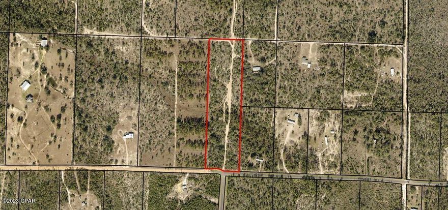 Nice country setting with this 9+/- acre parcel.  Property is mostly wooded and has a private road. Perfect for your new homesite, mobile homes o.k. Close to Hwy 231 for easy access to Panama City for shopping, medical, and to enjoy the beautiful white sandy beach.