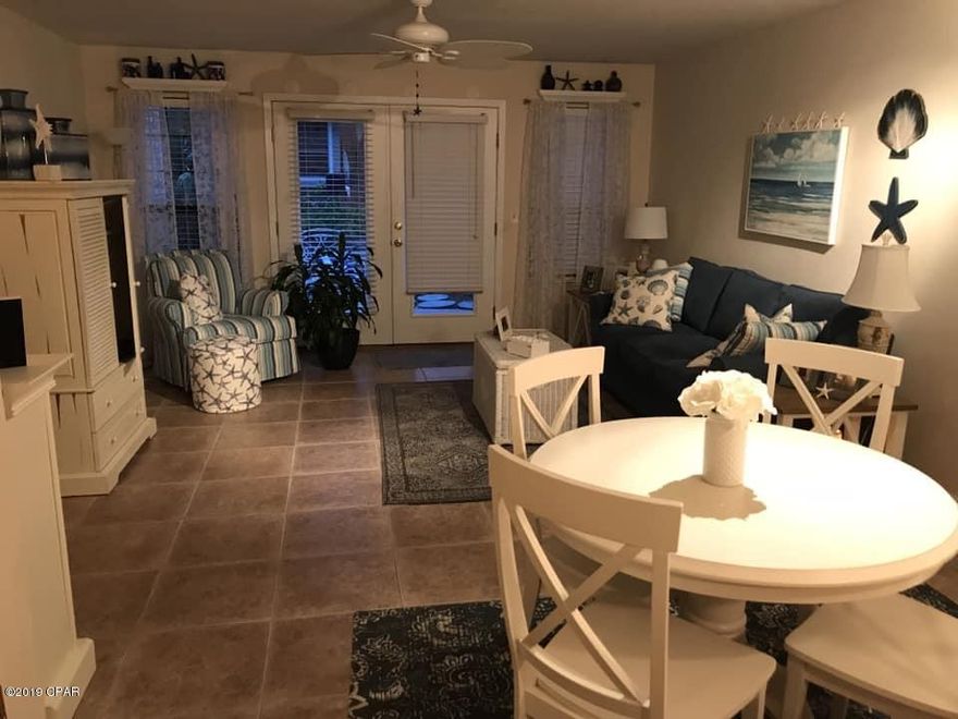 ***STUNNING TOWNHOME WITHIN WALKING DISTANCE TO ST. ANDREW'S BAY!!!*** This spacious 3BR/2.5Ba townhome features tons of natural light, an open concept living area w/ gorgeous tile, a downstairs master bedroom w/ ensuite bathroom, and newer back windows w/ French doors that open up to a lovely patio providing the perfect spot for your morning cup of coffee or grilling out. All appliances convey including the washer & dryer. New AC in 2014, new hot water heater in 2016, and new roof in 2017.  The low HOA fee covers the  groundskeeping for you as well as  garbage service. Seller is currently working with insurance to repair the minimal hurricane damage. Walk to the bay and enjoy our beautiful Florida sunsets! Must see this unit in-person to appreciate it. CALL TODAY!!