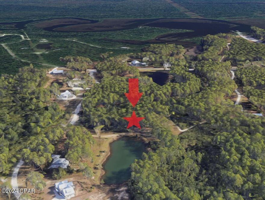 2 acre private, wooded Lot on a pond located in Panama City Beach in the exclusive, gated community of RiverCamps. Buildable area is partially located in Flood Zone X and is ideally tucked back on the acreage ensuring privacy with pond frontage and view. Huge area to build the house of your dreams!
RiverCamps is a gated, 1500 acre coastal sanctuary. Bordered by West Bay, IntraCoastal Waterway and Crooked Creek this waterfront community will have less than 450 homes on 500 acres when completely built-out. The remaining 1000 acres have been committed to conservation. There are 7 miles of connected trails and owners enjoy a community boat ramp with Shell Island and the Gulf a 30 minute boat ride away. There are also day-use boat slips and dry boat storage for owners. 
RiverCamps is conveniently located In Panama City Beach 10 minutes from the NW Florida International Beaches Airport and 10 miles from the famous white sandy beaches. 
Please call for the latest information on the rebuild of the RiverHouse and amenities. Pool and pavilion are now open!