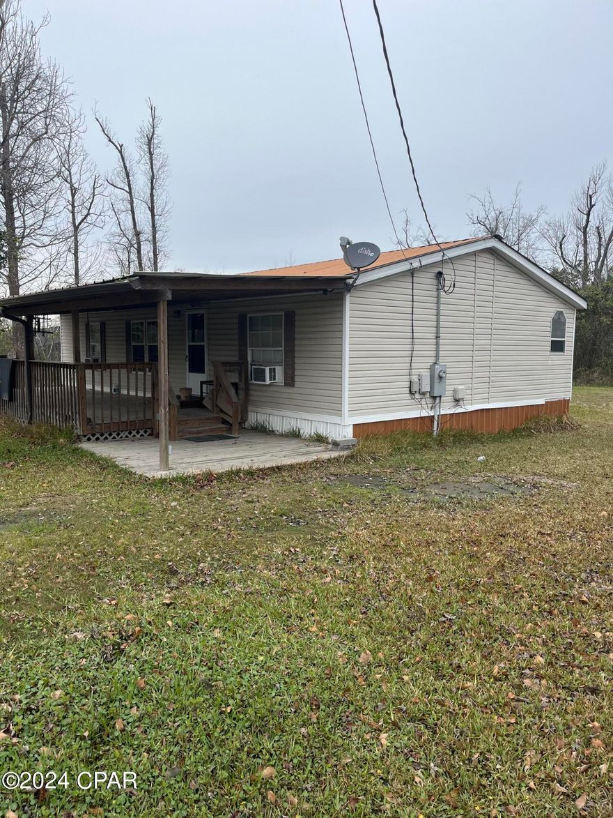 Motivated Seller! Double wide home located on an acre of land in Panama City/Lynn Haven line. 3 bedroom 2 bath unit with 2 out buildings and plenty of space!