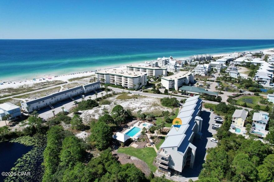 SOUTH 30A - Just steps from the Gulf of America! This coastal 1 bedroom condo in popular Seagrove Beach is only a 5-minute walk to the beach.  Enjoy stunning views of the Gulf, lake, and pool from your private balcony! Beautifully remodeled with coastal charm, this condo features soaring 18-foot ceilings, plank flooring, a custom staircase, built-ins, and shiplap accents. The kitchen and bath have been completely updated and it's offered furnished! Beachfront II Condos provides resort-style amenities including a heated pool, hot tub, grill area, covered pavilion, bike parking, golf cart charging station, and on-site laundry. The building has been recently updated with a new roof, Hardie board siding, and elevator. The Perfect 30A Location and offers  bike storage,  golf cart charging station, and on-site laundry. The building itself underwent extensive upgrades between 2020-2022, featuring a new roof, Hardie board siding, updated plumbing and electrical systems, and fresh exterior paint. A newly replaced elevator and three separate stairwells ensure easy access throughout the property. With public beach access just 50 yards away and Deer Lake State Park Beach within 300 yards, you're never more than a two-minute walk from the sugar-white sands and emerald waters. This prime location is tucked away for peace and privacy, yet close enough to walk or bike to Seagrove's shops and restaurants, or explore Seaside, Rosemary Beach, and all that coastal 30A has to offer. Call today and make this your home away from home away from home or your next smart investment in beautiful Walton County!