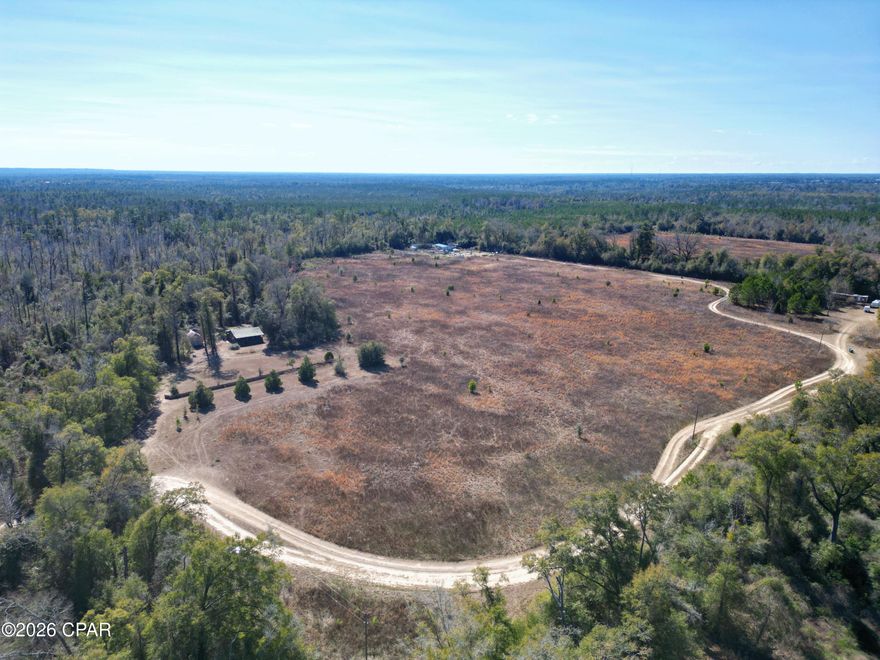 This nearly 80-acre tract offers the perfect blend of privacy, natural beauty, and convenience, located just minutes from the interstate at Sneads. Tucked away in a quiet, secluded setting yet easily accessible, the property provides an ideal opportunity for a recreational retreat, homestead, or long-term investment.

The land features a mix of dense timberland (50 acres) and cleared cropland (20 acres), creating a versatile landscape suitable for agriculture, hunting, livestock, or future development. 8 acres of a hardwood swamp provide potential for wildlife enjoyment. Abundant acreage provides space to explore, build, or simply enjoy the peaceful surroundings.

A two-bedroom, one-bath cabin sits on the property. Though the homesite needs some TLC, utilities, including electric, well, and septic are already available, providing additional potential for renovations.  There is also a storage building/workshop for equipment or hobby use. These buildings will convey in ''As-Is'' condition. 

The seller plans to parcel out approximately one-acre from the lot. This is a rare opportunity to own a substantial piece of land in a private setting with convenient interstate access.