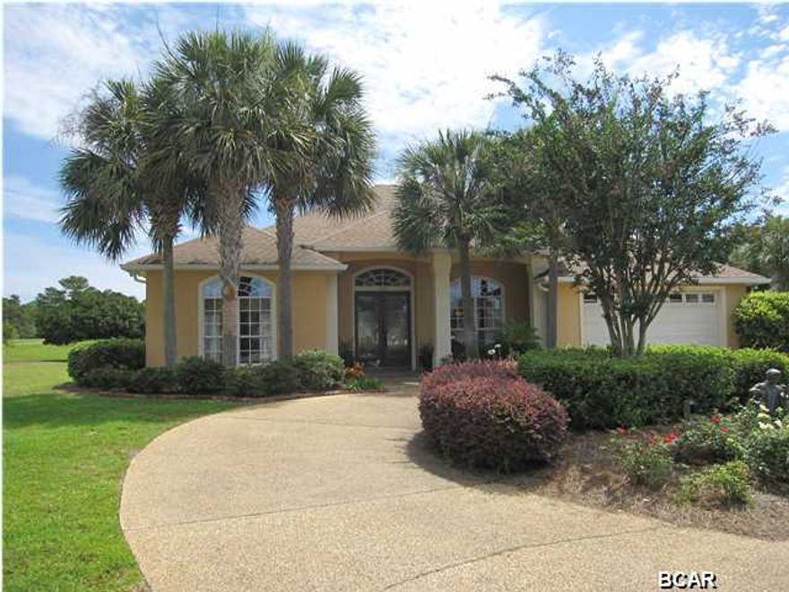 This elegant, executive home is located in the exclusive Dragon's Ridge section of Bay Point and overlooks the Nicklaus Golf course. It features 12' ceilings with crown moldings, new granite in the kitchen and bathrooms, stainless appliances, a large master bath with separate shower and whirlpool bath,built in bookcases, an interior laundry room, and a gas log fireplace. There is a covered, heated pool which was resurfaced in 2011. Dragon Circle has it's own park area with private tennis courts. All located in Bay Point, a gated community with 2 world class golf courses, clay tennis courts, a bank and post office, restaurants, and a full service marina just minutes from the open Gulf of Mexico.