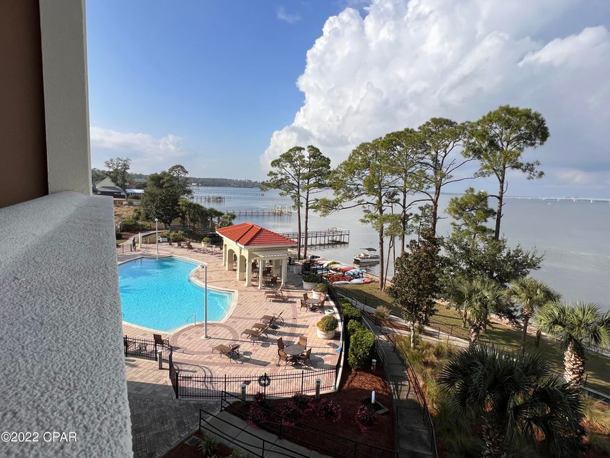 *Seller is offering $10,000 towards buyer's closing cost, rate buy-down or to use as needed! Spectacular views of St. Andrews Bay from this fabulous Magnolia Bay club 4th floor condo. This home offers 3 bedrooms, 3 full baths tons of storage and never ending views. The kitchen has all stainless steel appliances, granite countertops, wood cabinets, breakfast bar, New tile flooring. Wake up to a beautiful sunrise from your master bedroom, enjoy the sunset from your deck you get the best of both worlds from this one! The second bedroom features an en suite ensuring your guest have ultimate privacy. Magnolia Bay offers a bay front pool, clubhouse with pool table, kitchen area and fitness room, fishing dock, 4th floor extra storage, one covered assigned parking with tons of additional parking.