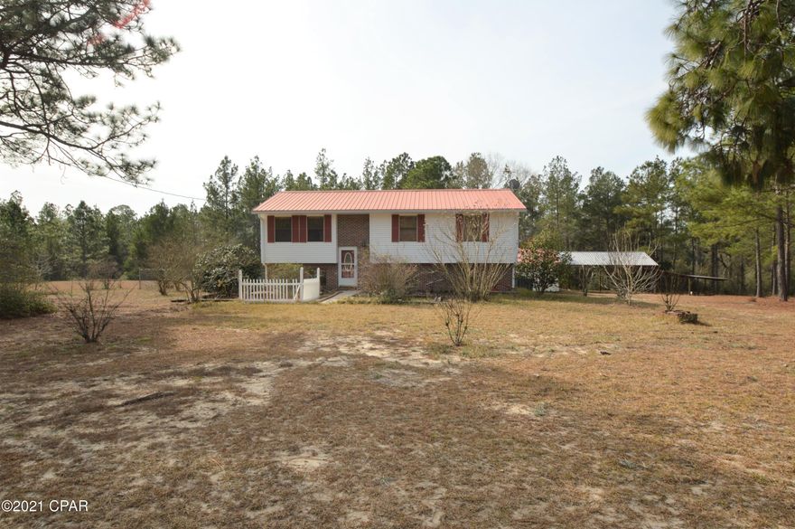 This home sits on over 40 acres with mature trees and outbuildings galore!  The first floor features two bedrooms and a full bathroom, as well as a kitchen with plenty of cabinets, and laundry room.  The second floor features an additional kitchen area, dining room, three bedrooms and a full bathroom.  The upper balcony is screened and the downstairs patio is oversized.  There is a storage building with a workshop area (12x12) and garage. Pole barn is oversized with lean to area.  There are also two smaller outbuildings.
