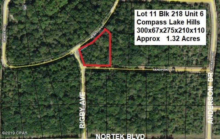 BIG 1.3 ACRE LOT JUST A FEW HUNDRED FEET NORTH OF PAVED NORTEK BLVD in the Compass Lake in the Hills community in NorthWest Florida. This lot appears to be Dry and has a very slight slope up from Rebecca Ct frontage to Sandpoint St. As shown on Plat this lot has frontage on three roads giving multiple options for Home and Driveway placement. Conveniently located about 15 minutes South of Interstate 10 at Marianna and about 40 minutes North of Panama City for Shopping, Restaurants, Entertainment, and Beautiful Gulf Beaches. As an owner in this development you have access to Private McCormick Lake for Swimming, Fishing, Canoeing, etc as well as the Main Lodge on Compass Lake with Swimming Pool, etc. ACT NOW to take advantage of this opportunity to BUY a BIG LOT at a GREAT PRICE !!