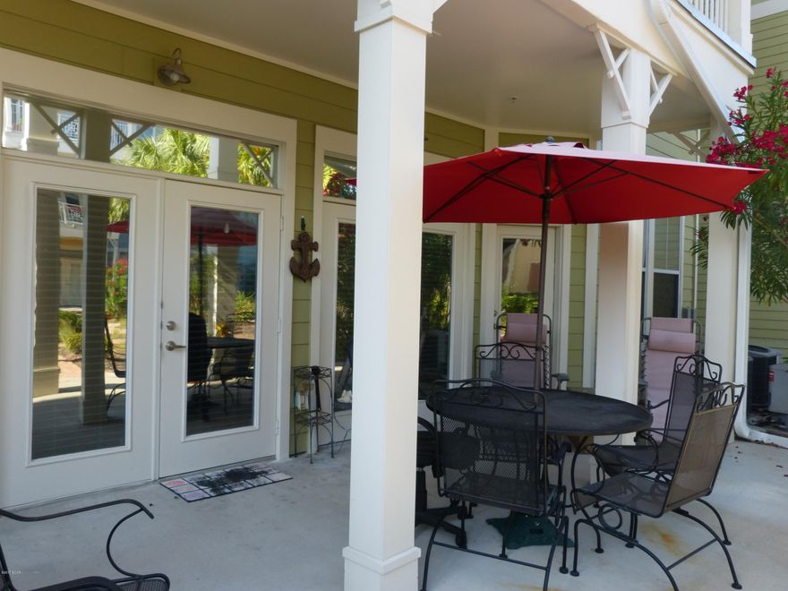 DESIRED GROUND FLOOR UNIT FACING COURTYARD IN BEAUTIFUL ISLAND RESERVE. The grounds have sought after amenities with tropical landscaping, one acre resort style lagoon pool with rock waterfall, game room, theater room, fitness center, and indoor basketball court. The unit features 10 ft. ceilings with crown molding, stainless steel appliances, granite counter tops, NEW built in cabinet in dining room, bamboo flooring in living/dining room, tile flooring in kitchen, foyer and baths.  Conveniently located to shopping, restaurants and the beautiful beach.  Age, sq. ft., and room sizes are approximate.  Please verify if important.