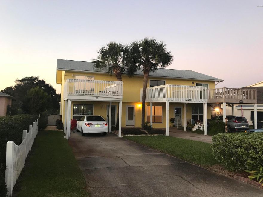 REDUCED!!!!  Motivated Seller!!!!    If you are looking for a fabulous vacation home steps to the World's Most Beautiful Beaches, you have found it!!  This home is very well maintained and has many updates!  A Must See!  Located less than 1 block to the Gulf of Mexico and on a Stocked Fish Pond!! This home offers so many features including, the front of home is landscaped with a beautiful rock garden, a nice storm door on front door, 1/2 bath downstairs for guests and convenience, both bedrooms are upstairs and each have a full bath attached complete with tiled floors. Master Bedroom has 2 large closets and a balcony overlooking the quiet lake and the Second Bedroom has a sun deck attached, you can watch incredible sunsets from both, The kitchen offers a nice breakfast bar and a deep sink. It has been updated with new, roof 2015, newer hot water heater, new paint inside & out including all walls, ceiling, doors, trim &  baseboards, decks, dock & balcony,,  laminate flooring upstairs, icemaker, levolor blinds, french doors, outside lights, 4 matching ceiling fans with light fixtures, light fixture in kitchen, carpet on stairs, metal roof on downstairs deck, rails around front sun deck, steps on back deck, light fixture on stair case, faucets in all 3 bathrooms and deep sink in kitchen with new disposal. Comes with a transferable termite bond.  The other 2 attached units are occupied by owners.
