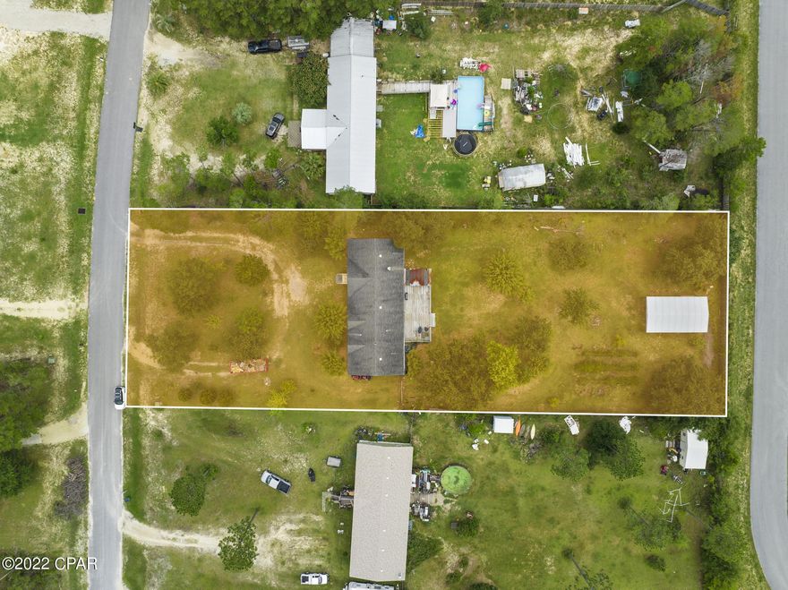 CURRENTLY UNDER CONTRACT, SELLER ACCEPTING BACKUP OFFERS  Move-In ready spacious double wide sets on an acre in the up-and-coming Southport area. Ample parking on a cul-de-sac for all your boats and toys. Large workshop shed already in place. Food delivery options available, so you never need to leave your home for groceries. Zoned for one of the top-rated schools in Bay County. Plenty of room to grow your garden and have a play ground for your chickens. Conveniently located to Northwest Florida Beaches International Airport and a short distance to the cut thru to get to one of the top ranked white sandy beaches, Panama City Beach.