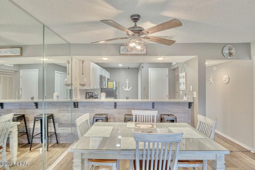 SHORT-TERM Rentals Allowed! Great CASH FLOW opportunity! This Luxurious Upgraded Edgewater Villa has been completely upgraded w/captivating furnishings & Modern/Beachy style! New LVP Flooring throughout (EASY CLEAN - NO CARPET); LVP Shiplap under Kitchen Bar; Polished Ceramic Subway Tile Backsplash; Granite Countertops; Stainless Steel Appliances; Luxury White Kitchen Cabinets; Freshly painted in light, beachy gray & brand new Furnishings, that makes this stand out from the rest!  Enjoy the private Balcony & Lake/Water views, soaking in the Gulf's Breeze! Spacious & Open Floor Plan & Walk-in Closets! Fully Furnished & Move In/Rental Ready! Plan your next VACA & Relax at the Beach, enjoy all of Resort Pools, Amenities, Local Restaurants & Shopping in Luxury & Style! YOUR Paradise Awaits! Exclusive Resort Amenities: Tropical Pools, Hot Tubs, Sun Decks, Beach Access. Restaurant, Room Service, Poolside Bar. Market serves Starbucks and Ice Cream. Everyone loves the Pizza Shop. Kids Club features Special Events, Splash Pad, Activities. At The Club owners play unlimited Golf, Basketball, Tennis and Shuffleboard. Enjoy the Fitness Center, Salon and Spa Services. Manned, Gated Entrances, 24-hr Security.