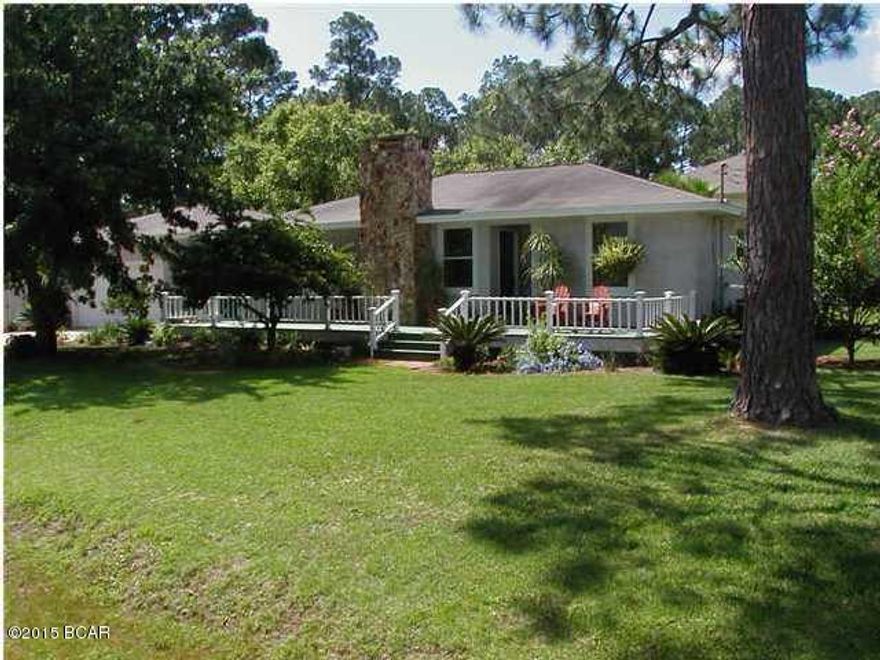 Beautifully located 2320SF (house and detached two car garage with workshop) of space with a view of the Bay this centrally located three bedroom, two bath home on two corner lots. It has a split floor plan with an open living room, kitchen and a fireplace. Effective year built is stated as 2000 per county records. Home has 1325 SF with over 2320 square feet under roof. Home has plenty of storage and an oversized garage with workshop & storage. The kitchen has solid surface countertops and an ample pantry. This home is all about the great outdoors with french doors leading to your fenced private backyard. Florida at it's best, near parks, recreation, shopping, schools and a short drive to the World's Most Beautiful Beaches!