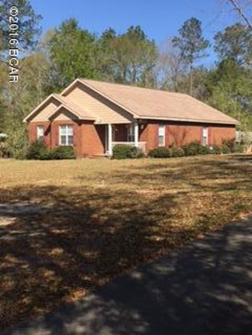 Nice country setting in The Nearing Hills Subdivision. This cute 3BR/2BA home is full of features including wood floors in kitchen, dining area, living room with an open floor plan, cathedral ceilings and molding. Lots of kitchen cabinets with a island. All three bedrooms are nice sized. Master bedroom has a walkin closet and masterbath has a large shower. Outside has concrete driveway, carport with storage room, and nice landscaping.