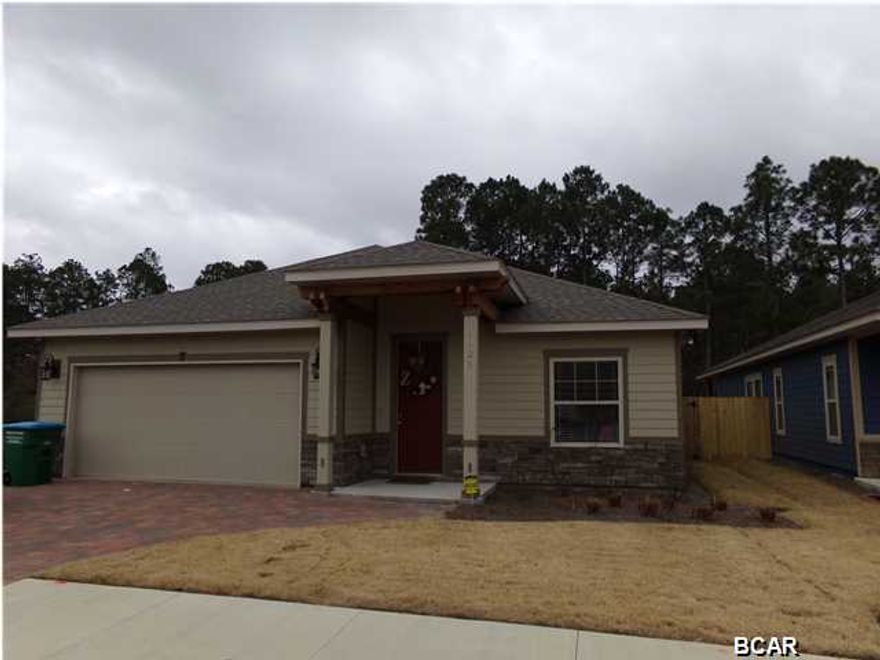 Almost New at Hidden Ridge! Corner Lot...The Fenced back yard ($3000), the separate Water Meter ($950) for the Sprinkler System, the Refrigerator ($1300) and the Washer and Dryer are included. Hidden Ridge is a New 21 Home, Secluded Subdivision in Lynn Haven off Hwy 390. Hidden Ridge has Underground Utilities, Paver Driveways, Sidewalks and Decorative Street Lights. This beautiful 4 Bedroom, 2.5 Bath Home features 9/10 Foot Ceilings, 20 inch Porcelain Tile Flooring throughout Main Living Area and Bathrooms. The Kitchen has All Wood Cabinets, Granite Counter Tops with under Mount Sink, Breakfast Island and Whirlpool or Maytag Stainless Appliances. Some of the Standard Features include: Tremendous Master Walk-In ''Step Down'' Showers with 2 Shower Heads, 8ft Interior Doors, Crown