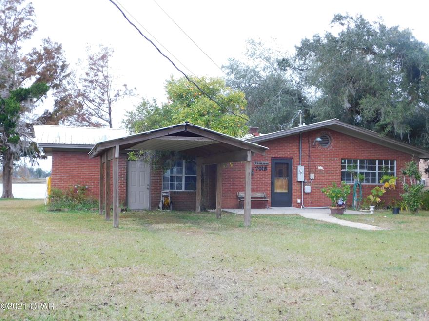 Fantastic fixer upper in a fantastic quiet neighborhood almost at the end of a dead end road so no thru traffic. This home sits right on Deer Point lake and has a private dock for storing your favorite toys and a great back patio for watching beautiful sunsets. The Livingroom view also includes the sunsets. Deer point lake views from the front house and the rear of this house. This is a blank canvas for you to make your dream home. Come see it now it will not last. More photos coming. All Measurements are approximate, take measurements if  important.