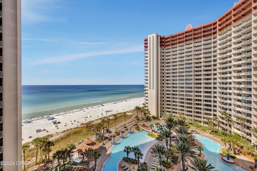 If you're seeking a standout, upgraded unit at Shores of Panama, this is the one to see. Experience coastal living in this beautifully renovated 2-bedroom condo, plus a private hall bedroom with a double bed and barn door for added privacy. Each sleeping area is complemented by its own dedicated full bathroom. This sought-after ''K'' floor plan is situated on the east wing of the 10th floor, offering stunning balcony views of both the resort's iconic lagoon pool and the Gulf. Enjoy the rare perk of a deeded parking spot conveniently located on the same level.

Thoughtfully designed with a touch of European elegance, this unit features modern-style furniture and finishes, ceramic tile flooring throughout, a sleek farm sink, and waterfall quartz countertops. Italian furniture, a sofa bed, and a Bose sound system add to the refined ambiance.

All bathrooms are updated with stylish half-wall tiles, custom showers with glass enclosures, and European vanities, faucets, lighting, backlit mirrors, and Euro-style commodes. The unit comes fully furnished and is rental-ready, making it a perfect investment or personal getaway.

Shores of Panama Resort features the largest Gulf-front lagoon pool in Panama City Beach. This zero-entry tropical pool includes palm-lined islands, fountains, and a spacious hot tub, all set against resort guest exclusive beachfront access. Guests enjoy an indoor heated pool and hot tub, a 24-hour fitness center, and a seasonal poolside Tiki bar.

The resort's location places dining, shopping, and entertainment within close proximity. Pineapple Willy's is adjacent to the property for beachfront dining. Laketown Wharf, directly across the street, offers Juan Taco, Wharf Seafood Buffet, The Candymaker Ice Cream Shop, PCB Pizza, In Cahoots for breakfast and brunch, The Press coffee shop, The Bun Lab, 810 Billiards & Bowling, a salon and nail bar, and additional retail options.

Nearby recently opened attractions include Dolly Parton's Pirates Voyage Dinner & Show, Topgolf, and McGuire's Irish Pub. Tootsie's Orchid Lounge is scheduled to open in 2026, reinforcing continued commercial investment and growth in Panama City Beach.

Covered parking, complimentary Wi-Fi, and on-site security enhance the guest experience, contributing to Shores of Panama's position as a consistently high-demand Gulf-front resort.

HOA dues are $3,981.60/quarter. All information and HOA fees are deemed accurate but should be verified by buyers if important.