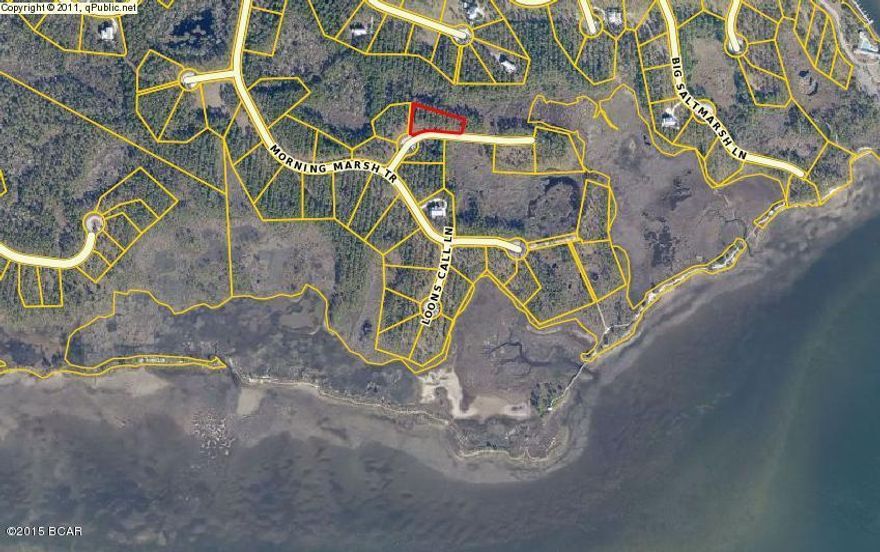 This is the lowest listed lot in Rivercamps!!!  A house will have views of the bay in many directions from its second floor decks.