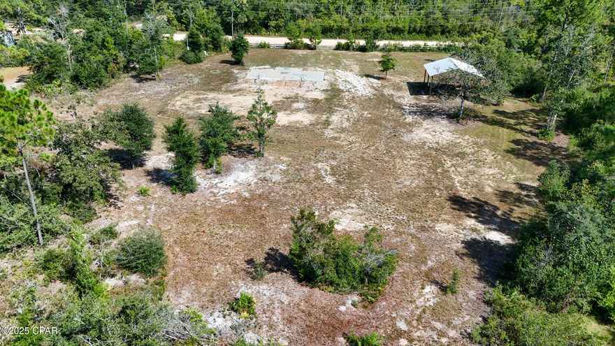 'CURRENTLY UNDER CONTRACT, SELLER WILL CONSIDER BACKUP OFFERS' Discover your private retreat in Fountain, Florida! Just 35 minutes from Panama City and 50 minutes from the sugar-white sands of Panama City Beach, this parcel offers the perfect blend of convenience and privacy. Located just off Hwy 231 and only two miles north of Hwy 20, this property provides the ideal balance of accessibility and seclusion with no HOA restrictions.
The property is already improved and includes a  survey, fencing, and a filled foundation form. There is a deep well, a newer septic system with lift station, and a temporary power pole in place. A spacious pavilion-style RV high carport is also included, making the land ready for immediate use. The front section of the property has been cleared for building, while the rear boundary has been preserved in its natural state, creating a peaceful setting where deer and wildlife roam freely.
With all of these improvements, utilities, and infrastructure already in place, this property offers incredible value at $128,000. Whether you are looking to build your dream home, create a weekend retreat, or simply enjoy the land as it is, this opportunity is truly a big bang for your buck.