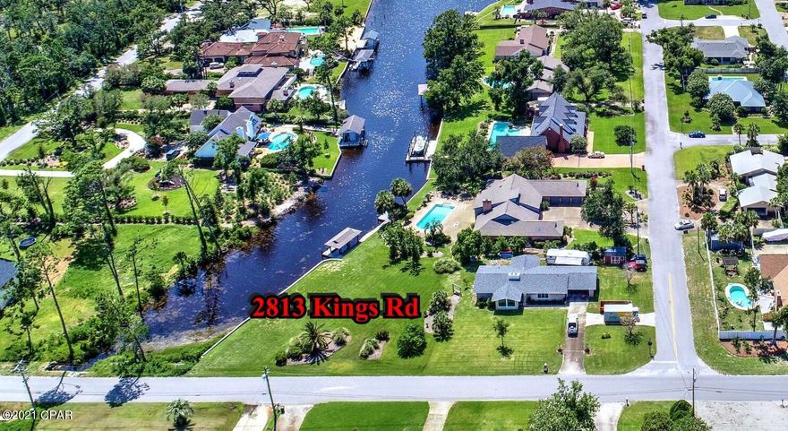 CURRENTLY UNDER CONTRACT; SELLER WILL CONSIDER BACKUP OFFERS. Canal front lot in Kings Point with seawall and navigable to the bay and Gulf of Mexico.  Fantastic Sunsets looking down your canal! This nearly half-acre lot has been cleared and landscaped and you'll love the vinyl seawall that has been installed.  This lot is ready for your new home!  Centrally located, close to shopping, dining, medical facilities and more.  Lot will support septic and well according to Veteran Septic. Bay County Zoning and Building Dept. say the lot can be built on. Seller says it takes approx 20 minutes by boat to get to the Gulf!  All info approx and must be verified by Buyers if important.