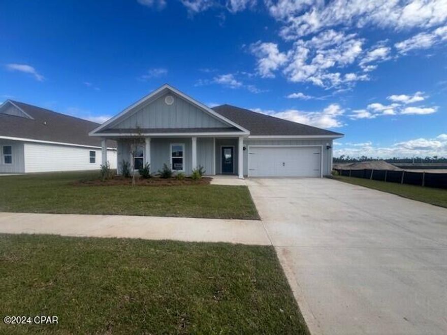 New home under construction in Phase IV of Liberty. This home is located at 6570 Weems Way and features the Victoria floor plan. This is a highly popular floor plan that features a hallway just off the foyer, that leads to three bedrooms, the laundry room and a shared bath with a shower and tub combo. The long entry leads to an open living room with trey ceilings, and a spacious kitchen featuring a large corner pantry and center island. The interior features of this home include, quartz countertops, EVP flooring, beautiful white cabinetry and a stainless-steel appliance package including a smooth top stove, microwave and dishwasher. The primary bedroom is located at the back of the home and has a large bathroom with plenty of closet space. The primary bathroom has a nice size shower and a separate soak tub. This home is equipped with Smart Home Technology package which includes a DEAKO smart switch, a Qolsys touch panel that can be integrated to control your thermostat, lighting and even secure your home. Access your home at ease with the keyless Kwikset door locks. The exterior of this home is constructed with Hardi siding, dimensional shingles on the roof with a 30 Year Warranty. Liberty features a beautiful amenity center, many floorplans to choose from, and an expansive landscape with almost 2,000 homes planned and is a great choice for military personnel working at Tyndall Air Force base as it is only about a 15-minute drive away. Liberty is located off Highway 231 and Star Avenue making it a short drive to shopping, food, schools, and the beautiful beaches of Panama City Beach.