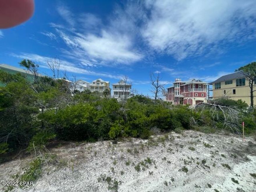 Premiere 1st tier X FLOOD ZONE lot on the North Cape! Very rare opportunity to have X flood zone designation this close to the beach which means ground floor living space is an option. Excellent location for this homesite that is adjacent to dedicated beach access and boardwalk, and across the street from the community pool. Lot is located behind the CCCL line so there will be no waiting for FLDEP permits, just county building dept.  San Dunes is a small north Cape subdivision with a nice large, deep beach with plenty of beach room to have a great time without congestion. Existing homes are all relatively new, nice size and stature. All measurements and dimensions taken from Gulf Co Property Appraisers website, verify if important. San Dunes Covenants and Restrictions in documents.