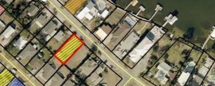 Welcome to the rare opportunity to own a premier building lot in Panama City Beach's sought-after South Lagoon neighborhood! Perfect for developers, builders, or anyone dreaming of a custom waterfront home, this lot is walking distance to two public lagoon accesses and the Dolphin Drive boat ramp with dock--ideal for boating enthusiasts. Situated directly on S. Lagoon Drive with beautiful water glimpses and golf cart-friendly charm, it's just blocks to Gulf beaches, top restaurants, lively bars, and PCB attractions, plus a short drive to St. Andrews State Park (fishing pier, nature trails, snorkeling) and Navy Support Center. This unbeatable location offers relaxed coastal living with easy access to everything that makes Panama City Beach special--don't miss your chance to build in one of Florida's most desirable communities!