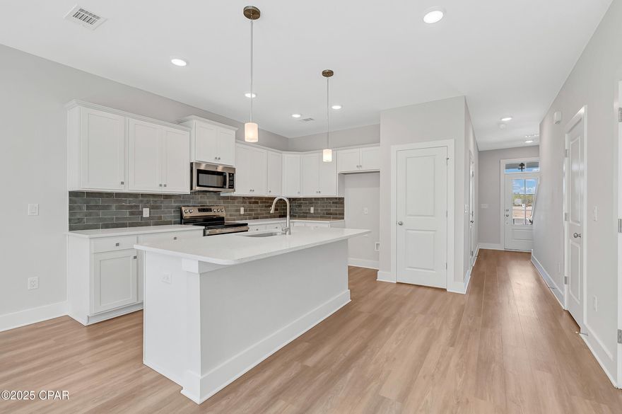 Seagate at Clara is a new townhome community nestled in the vibrant city of Panama City Beach, FL. This two story features board and batten exterior and covered entries. One car garage provide a great space for storing beach essentials. These open concept townhomes boast stylish kitchens with large islands perfect for gatherings. The elegant Owners Suite is designed with comfort in mind showcasing a large walk in closet and double- bowl vanities. The community pool is opening in May with cabanas, lounging, seating and grilling stations. The dedicated dog park with be compete in April. This community is in a prime location with a nice walk to local shopping and the beach. You'll enjoy the white sands of the Gulf of Mexico and be just minutes from Pier Park.