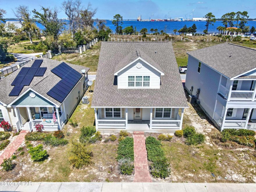 Here it is! Magnolia Bay is a gated community with a beautiful pool and easy access to the small pier. Watch the kayakers and boats passing in St Andrews Bay while you enjoy a great view of the Hathaway Bridge!  Located in a prime spot close to the beach, you will truly enjoy the great things around you including brand new and well known Restaurants just minutes away! There are 3 bedrooms AND 3 bathrooms in this precious home. There is one bedroom downstairs and 2 bedrooms upstairs. You will love the floor plan and the parking pad in the back made of beautiful pavers.  The living space is great and high performing popular schools are zoned for this subdivision.  Do you need use of a gym? No problem since there is also one of those in this community! You should love this neighborhood!