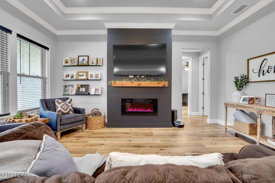 Built in 2021 this craftsman 4-bed 2-bath with modern details, sits in a quiet family friendly neighborhood in Southport with NO HOA! You can live here for ZERO DOWN, this home is USDA eligible! This home has many upgrades and unique features that include 8' doors, custom light fixtures, recessed lighting throughout,  9 and10 ft  ceilings, with 12-foot tray ceilings and custom shiplap walls. The split floor plan provides space and privacy. The beautiful kitchen features a large granite island, chevron tile backsplash, a custom pantry, deep workstation sink, and stainless-steel appliances. Bathrooms feature beautiful quartz countertops and tile flooring.  The master bedroom is spacious and the custom master bath features a quartz There's a soaker tub and extra storage as well. The walk-in master closet will hold all you need. The bedrooms are spacious with very large closets! Entering from the garage the large custom bench with compartments and hooks gives the perfect storage space as you come home to keep all your stuff in one place! Almost 3/4 of an acre is completely fenced with lighting on the fence, double gates on one side and a single entry gate on the other. No worries about anyone building behind you as it's a protected area! Don't miss this one, it won't last long!