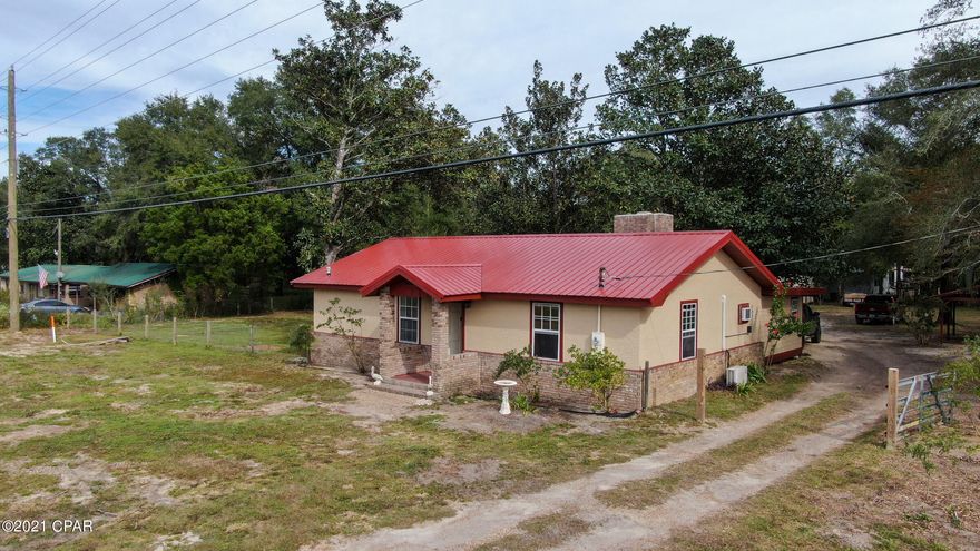 CURRENTLY UNDER CONTRACT, SELLER ACCEPTING BACKUP OFFERS. Completely renovated 4Br/4Ba home! This home features new roof, new paint, new flooring, new appliances, new fixtures, new cabinets, new bathrooms, new septic system, and completely rebuilt well.  The home sits on almost 1 acre of land with frontage on Hwy 77 and Blocker Church Rd. The yard is huge with old growth trees and is located less than 45 minutes to Panama City Beach And 30 minutes to town. All measurements are approximate, verify if important.