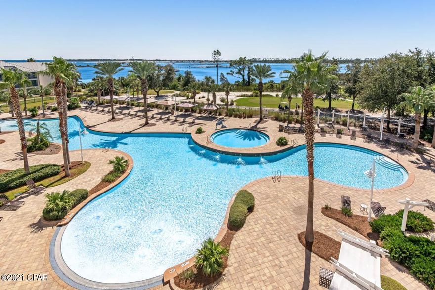 Welcome home to Reflections at Bay Point! You will enjoy breathtaking views of the lagoon, St. Andrews pass, golf course and resort style pool from the large waterfront balcony of this 1BR/1BA fully furnished condo. This upgraded unit includes granite countertops, stainless steel appliances, plank flooring, sleeper sofa and washer and dryer. Enjoy access to the onsite pool, hot tub, and spa or walk down the boardwalk to a restaurant and the beach. This unit is currently on a vacation rental plan through Vacasa. Approximate gross rental in 2020 was $20,000, but due to COVID-19 rentals did not open until Memorial Day. Bookings to date in 2021 approximately total $25,000.