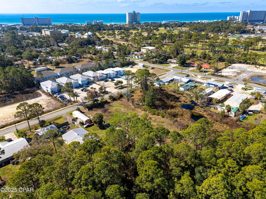 CURRENTLY UNDER CONTRACT, SELLER ACCEPTING BACKUP OFFERS. Calling all builders and investors - PRIME investment opportunity with ACTIVE DEVELOPMENT ORDER and ARCHITECTURAL PLANS in place! Welcome to Laird Retreat. This unique, pre-cleared lot is over one acre in size and sits less than one mile to the nearest beach access in Panama City Beach. For builders with a vision beyond the existing plans, which could include multi-family units or additional single-family homes, the current R-2 ZONING allows for up to 15 units on this property. These could be suitable as primary residences or vacation rentals. The possibilities are vast. The current development order is good for the construction of four single-family homes at 1733sqft each that are all located in FLOOD ZONE X. Enjoy peace of mind and the ability to begin construction quickly knowing that this lot already has a development order in place. The existing Civil Plans were prepared by B & C Engineering and Services LLC. The survey, civil plans, architectural plans, and geotechnical report are all available to be shared for review. The seller has invested substantially in this property and planned to see his vision come to fruition, but plans changed and now someone else can take advantage of this unique opportunity. Schedule your showing today!