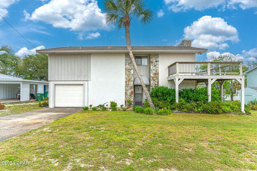 BACK ON MARKET DUE TO NO FAULT OF THE SELLER - This spacious 2-story beach house just steps away from the Gulf features 4 bedrooms, 3 bathrooms, and sits on a generous 0.206-acre lot, offering plenty of space for outdoor enjoyment and potential expansion. With the ability to convert both the garage and the 600 sq ft at the back of the house into additional living space, it is perfectly suited for an investment as a rental property. With some cosmetic updating, you can transform this gem into your dream coastal retreat. The wood deck provides the perfect spot for outdoor entertaining or simply soaking in the breathtaking views of the surrounding area. The interior of the home features a comfortable layout, with ample living space spread across two levels. The main floor encompasses a cozy living room, a well-appointed kitchen, and a dining area, providing the ideal space for gatherings with family and friends. Beach access is located just 0.1 miles away allowing you to enjoy all that Panama City Beach has to offer. Whether you're looking for a permanent residence, a vacation getaway, or an investment opportunity, this beach house presents an exciting chance to create your own coastal oasis. HVAC 2012, Roof 2014, HWH 2015