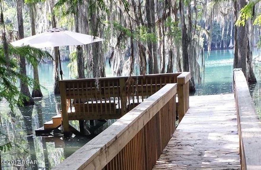 Outstanding Lot on Merritt's Mill Pond!! Waiting for you to build in the beautiful Spring Chase subdivision. This is the prime location in remarkable Marianna Florida! Merritt's Mill Pond is fed by a natural spring that is part of Blue Springs Recreational Area. The spring produces approximately 80 million gallons of water per day. Very popular with cave divers, kayaks, boaters,fisherman and sportsmen alike! Lot beside this one is also for sale!