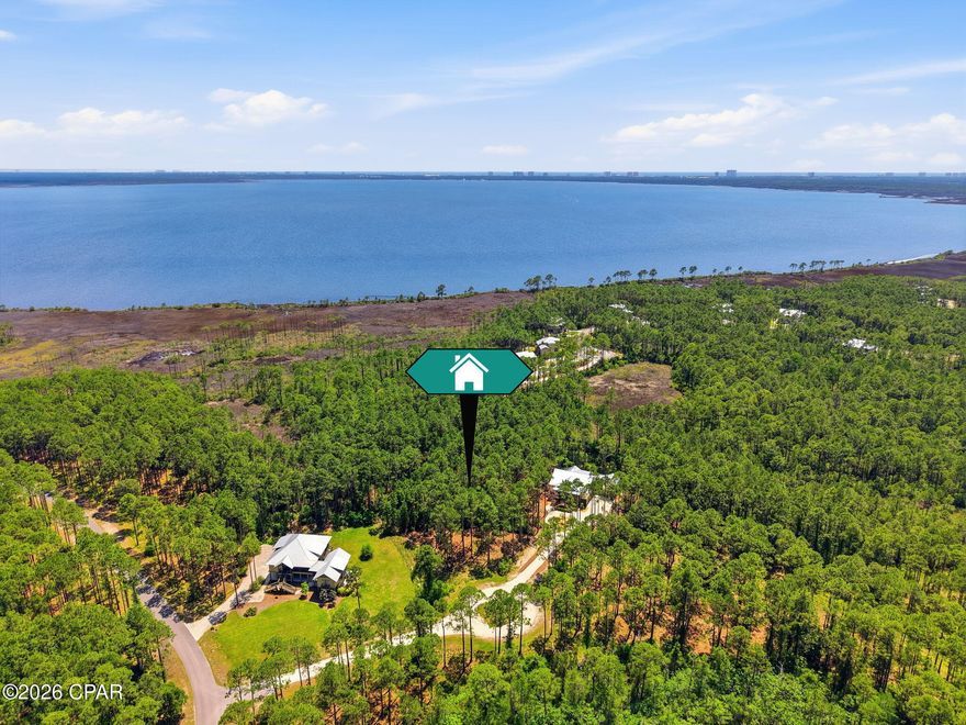This 1.2 acre homesite provides the perfect setting for a private retreat, one of the largest buildable lots in the community! Experience the RiverCamps lifestyle surrounded by lush conservation and scenic waterways. RiverCamps is a gated waterfront community known for its exceptional amenities, including a pool overlooking the bay, miles of walking trails, boat ramp and storage, day-use boat slips, and future fitness center. Residents enjoy direct access to Crooked Creek, West Bay, and the Intracoastal Waterway, all ideal for boating, fishing, kayaking, and exploring the natural beauty of the Florida Panhandle. Conveniently located near the best of Panama City Beach: new hospital, shopping at Pier Park, dining, a 10 minute drive to the beach, and less than 30 minutes to 30A. Select your own builder and customize your dream home on your own terms. Builder plans and Survey available upon request.