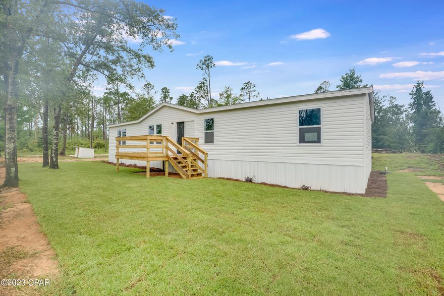 Welcome to this charming double-wide mobile home situated on a spacious corner lot, boasting a paved road for easy access. This meticulously renovated property offers a fresh and modern aesthetic, with brand new luxury vinyl plank (LVP) flooring throughout, as well as a fresh coat of paint that complements the home's inviting atmosphere.

The upgrades continue as you step inside, where the electrical system has been completely updated to ensure both safety and convenience. The exterior of the home showcases new siding, windows, and air conditioner, providing enhanced energy efficiency and a polished look.

Relax and entertain on the newly constructed decks, offering ample space for outdoor enjoyment and gatherings with family and friends. 

The kitchen features new appliances, as well as a large butcher block island.  These improvements make this home move-in ready, offering the perfect combination of comfort and style.

Don't miss the opportunity to make this stunning double-wide mobile home yours, with its corner lot location, upgraded features, and convenient access to 231. Schedule a showing today and experience the charm and convenience of this incredible property.