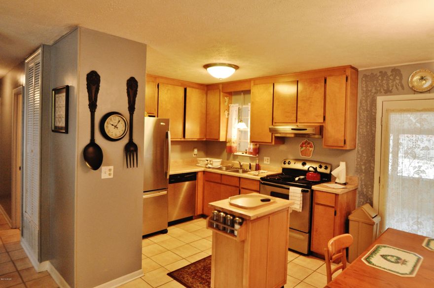 ***JUST REDUCED** SELLER SAYS BRING OFFERS USDA 100% Financing on this immaculate 3 bedroom home that is only 5 mins to Tyndall AFB. Nice open floor plan Island Kitchen, Huge corner lot. The Children play ground is included along with the picnic table and swinging chair and storage unit. There is a huge 10x25 covered screend parch with nice mood lighting.. Sit out there and watch the children play.. or have a nice BBQ with friends. The back yard is completely fenced with 6' privacy fence. This property is zoned for commercial use as well as residential. You can run your own beauty shop, workshop, auto shop out of the garage. You are close to everything.. shopping, eating, beach...what more do you need? and all this for under $100,000.. close to public boat ramp