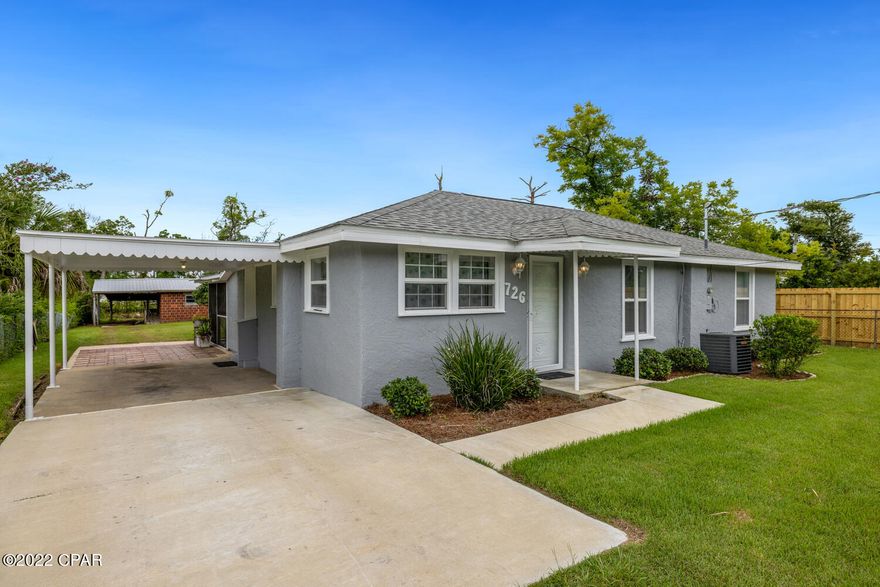 take another look!  This 1/2 acre parcel has been well-maintained by the original owners. The home boasts 3 bedrooms, plus there is an additional large brick, building and 3 carports!  . The roof is new as of 2019, the interior & exterior has been freshly painted and the home is move-in ready. On the rear of the home is a screened-in patio & a big, private outside shower. The lot is cleared, and fruit trees are blooming. (All info is approximate and not guaranteed.  Buyer to verify any/all info that is important)