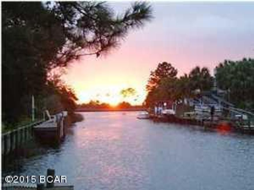 Price Reduction- now priced $30,000. below the October 2015 Appraisal Price--Sellers want this house sold immediately-- Deal unexpectedly fell through just a few days prior to closing. House has passed all inspections & appraisal for FHA financing. An excellent opportunity to pick up a house ready to close quickly!! This is a remarkable opportunity to purchase a  Waterfront house with in ground pool on a navigable canal for a bargain price---

Very rare find---dock with 3000# boat lift- Interior is open & spacious with lots of windows to accent the beautiful views of the canal and the pool. Tiled throughout for added value & convenience. Large rooms- 3 BR/2BA-This is truly an excellent bargain. The perfect house for the Buyer who wants navigable waterfront with a pool--on a budget--- Ask your Realtor to show you this one! All information & measurements are approximate & should be verified if importan