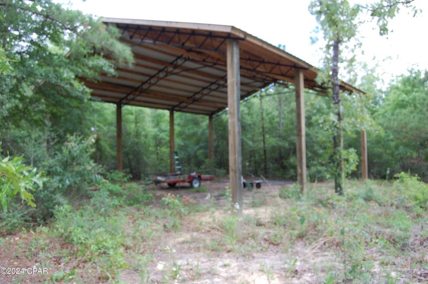 Very nice 1.3 acre lot completely fenced with entry gate, power pole & electric, and 32 X 36 pole barn.