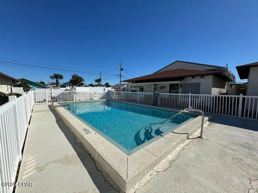 If hearing the waves crash into the shore is what you want to hear when you open your windows.. THIS is the place you want to buy!  This 2 bedroom 1 bath condo is freshly updated and ready for a new owner.  Windows, HVAC and roof replaced 2019, water heater replaced 2023.   HOA covers community pool, basic cable, garbage water/sewer and lawn service in this quiet beachside community. Location is ~900ft to the nearest beach entrance and complex is 1 block north of Thomas Drive.   Close to Navy Base and many nearby restaurants and shopping centers.  Washer and Dryer is included.  Unit comes with an outside storage area and a small back yard that can be fenced with HOA permission.  Call today and be living here in Summer 2026!!