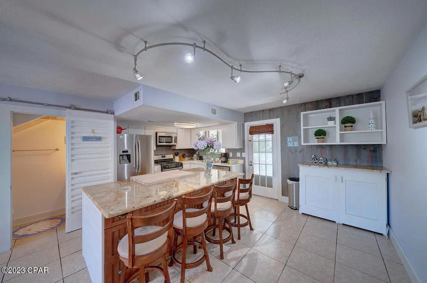 Stylish townhouse available for long-term rental in the coveted Gulf Highlands Beach Resort. Upgrades abound, featuring solid wood closet systems, bespoke barn doors, built-in bunk beds, and artisan-crafted stairs. Enjoy modern appliances and a full-size washer and dryer in an interior laundry room adjacent to the expansive primary bedroom huge walk-in closet. Step outside to a beautifully landscaped garden patio with shade—perfect for entertaining or relaxation. A new roof installed in 2020 ensures peace of mind.

The resort offers an impressive array of amenities, including 11 pools (5 heated), mini-golf, shuffleboard, gated entry, and more. Additionally, this townhome boasts exclusive community access to a private beach and a beachfront pool with a cafe, elevating the coastal living experience.