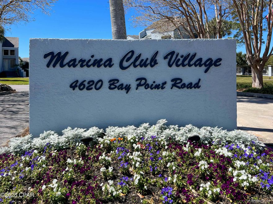 From your deck of this beautiful ground floor unit, enjoy the panoramic view of the Grand Lagoon teaming with  boat traffic cruising in and out of the marina and around the bay!  It's a short walk to the full service marina with all the yachts and nautical activities!  Located in Bay Point, a gated community featuring 3 restaurants, a championship golf course, clay tennis courts, 24 hour roving security, and our deep water marina just minutes from the Gulf of Mexico. Check out the Mercedes convertible and golf cart in the garage and say, ''let's make a deal''!